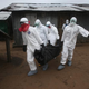 A Liberian burial team wearing protective clothing retrieves the body of a 60-year-old Ebola victim from his home near Monrovia, Liberia, on Aug. 17, 2014. The epidemic has killed more than 1,000 people in four African countries, and Liberia has had more deaths than any other country.
John Moore/Getty Images